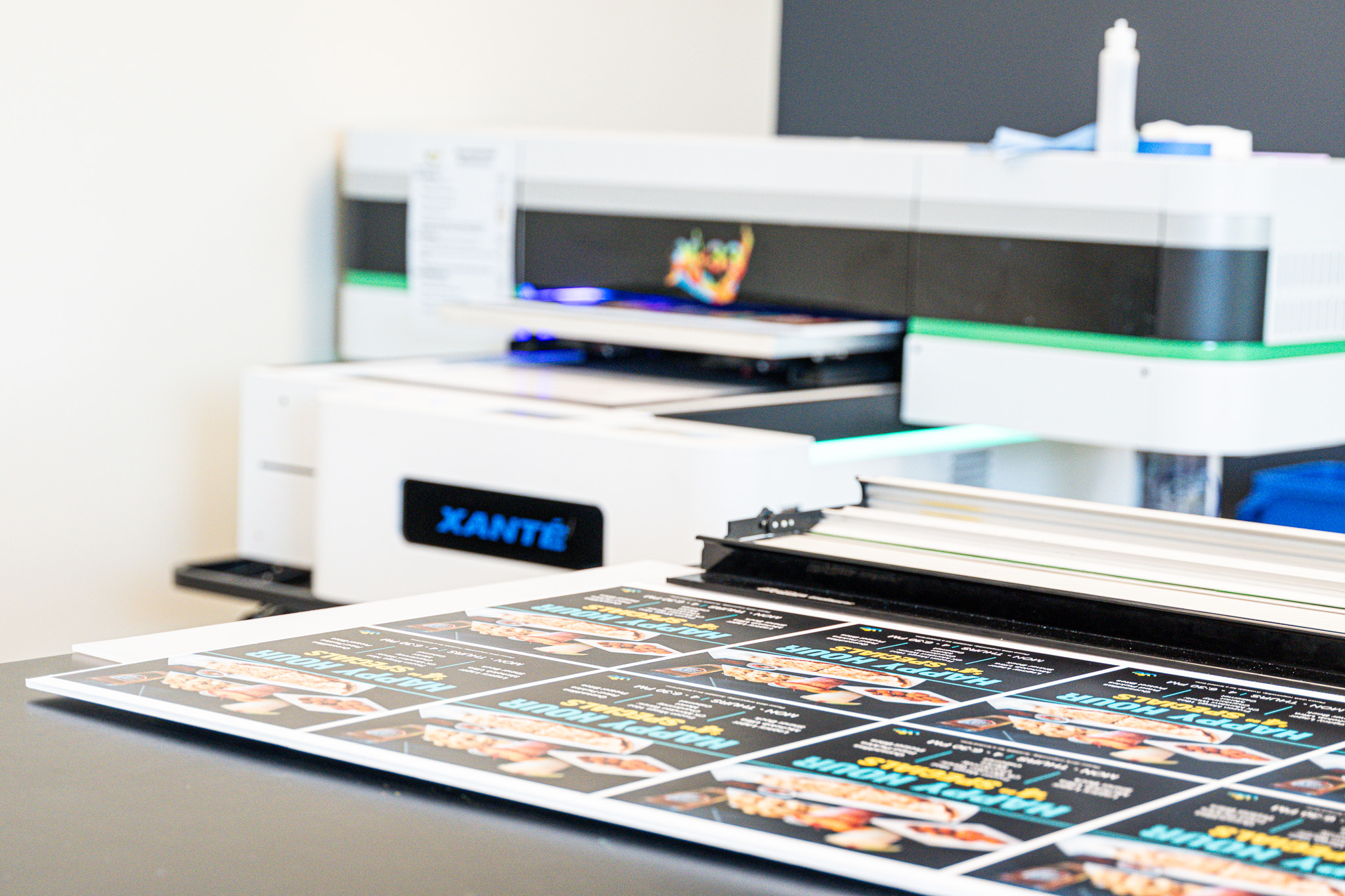Production printers with print work on the side.