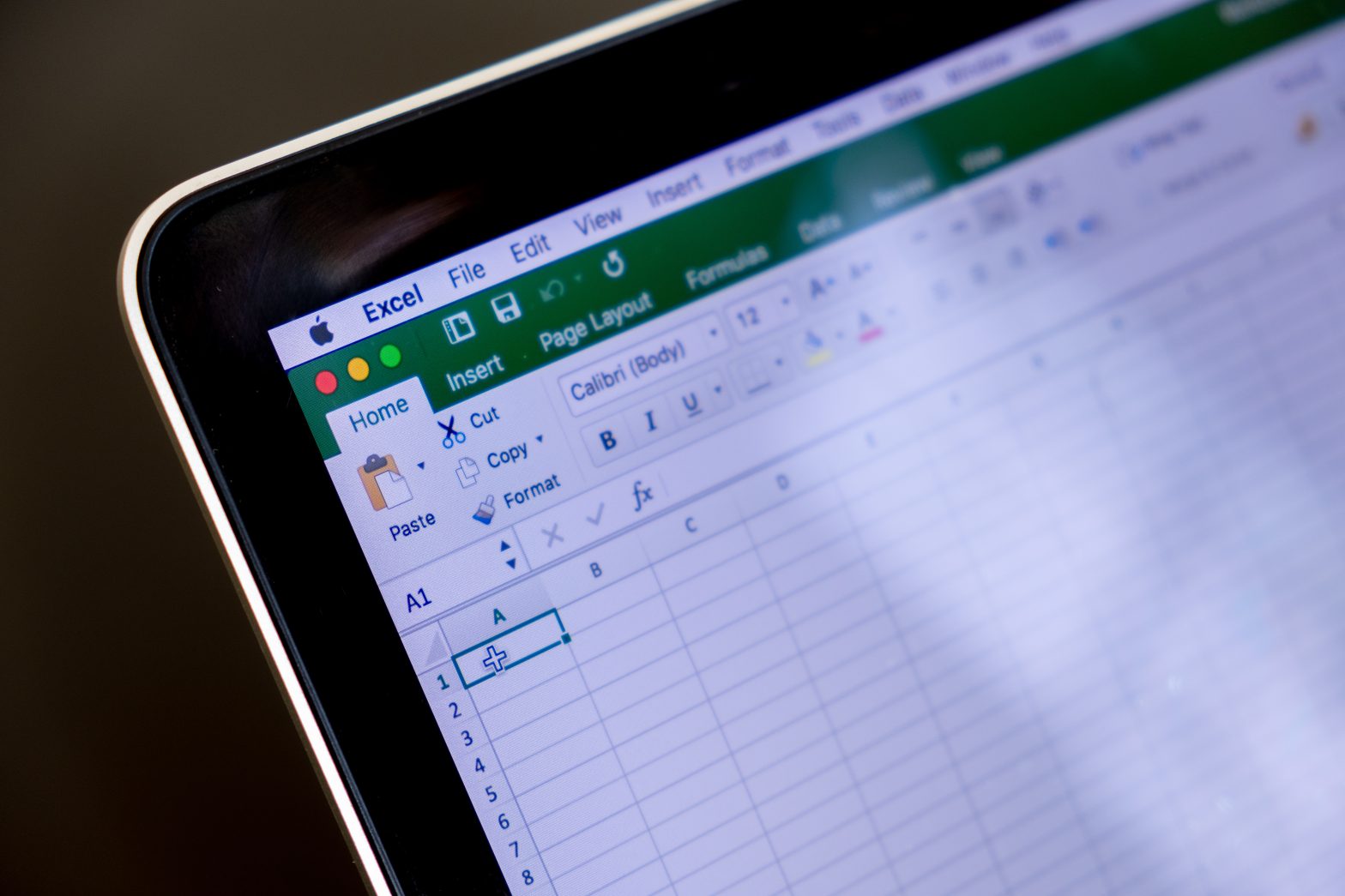 Corner of computer with an Excel sheet open.