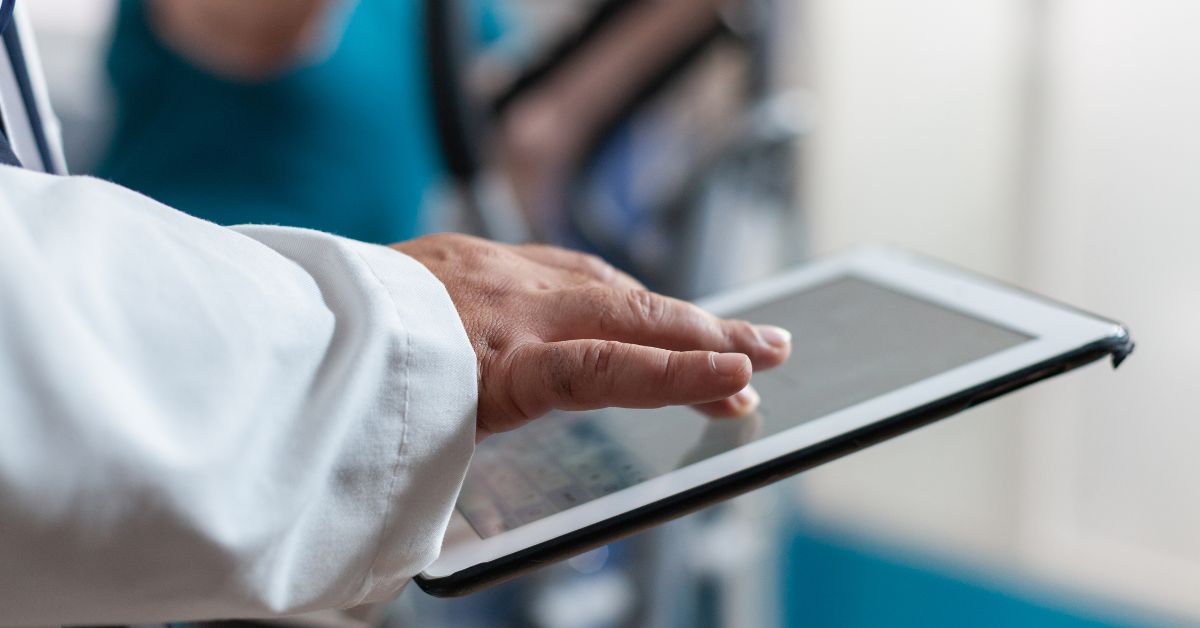Hand touching an Ipad