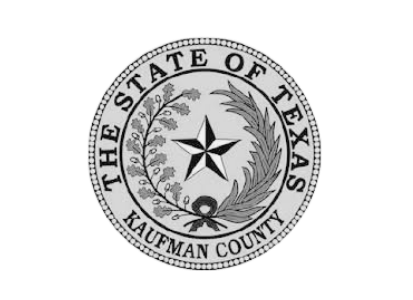 Kaufman County Texas seal featuring a central star surrounded by wreath elements and “The State of Texas” text around the border on a transparent background