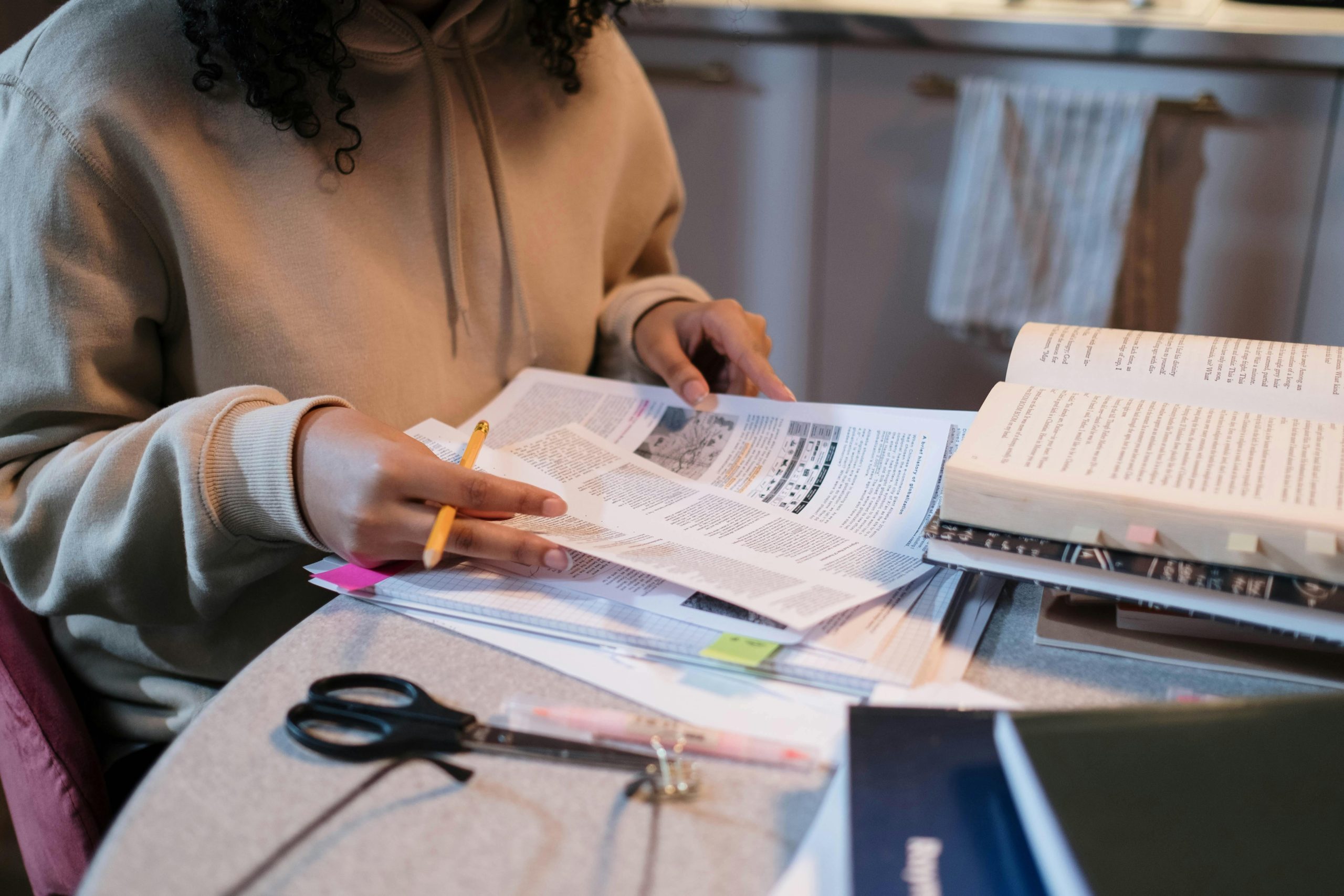 Student studying printed coursework