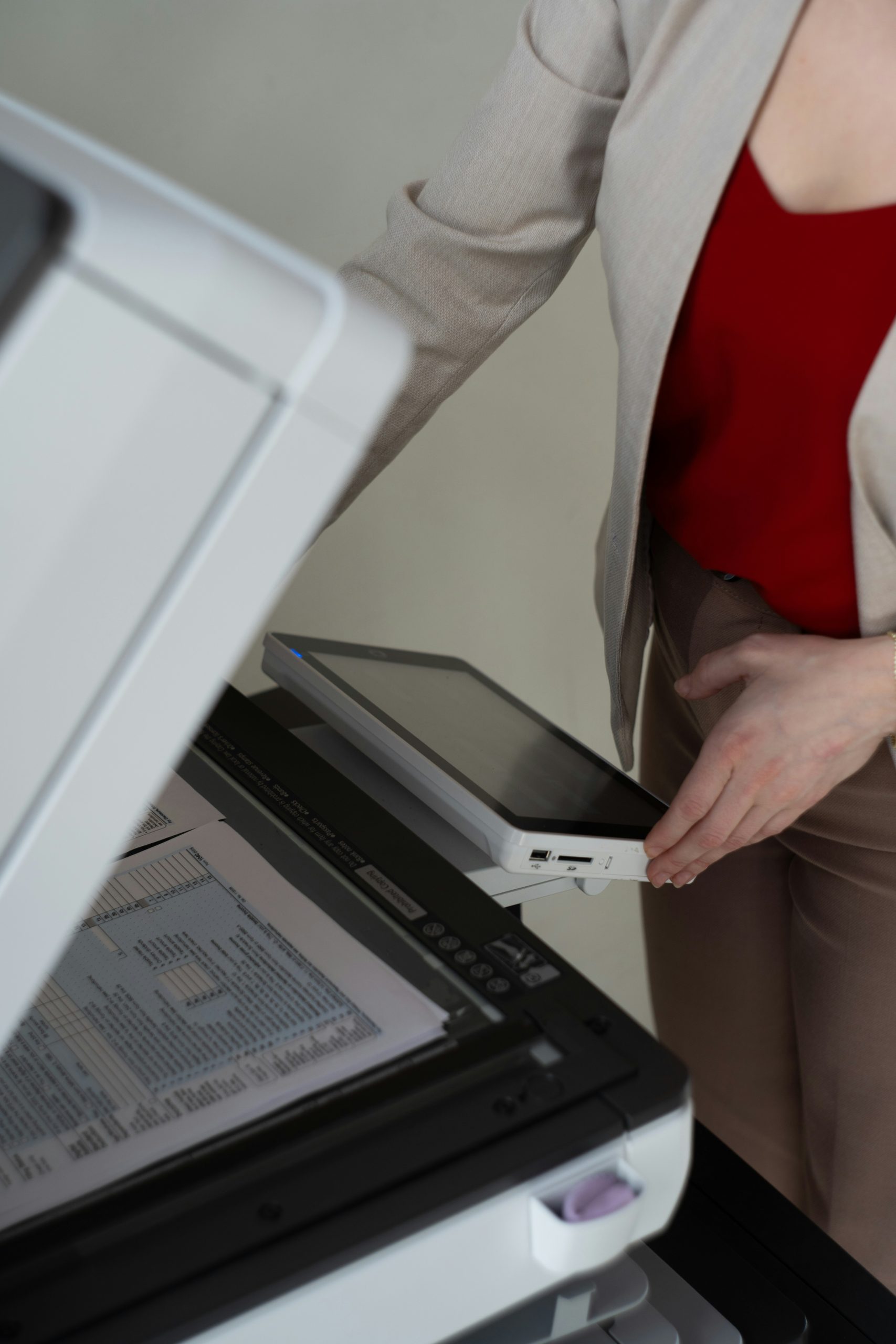 Close up of hand using printer's built in touchscreen