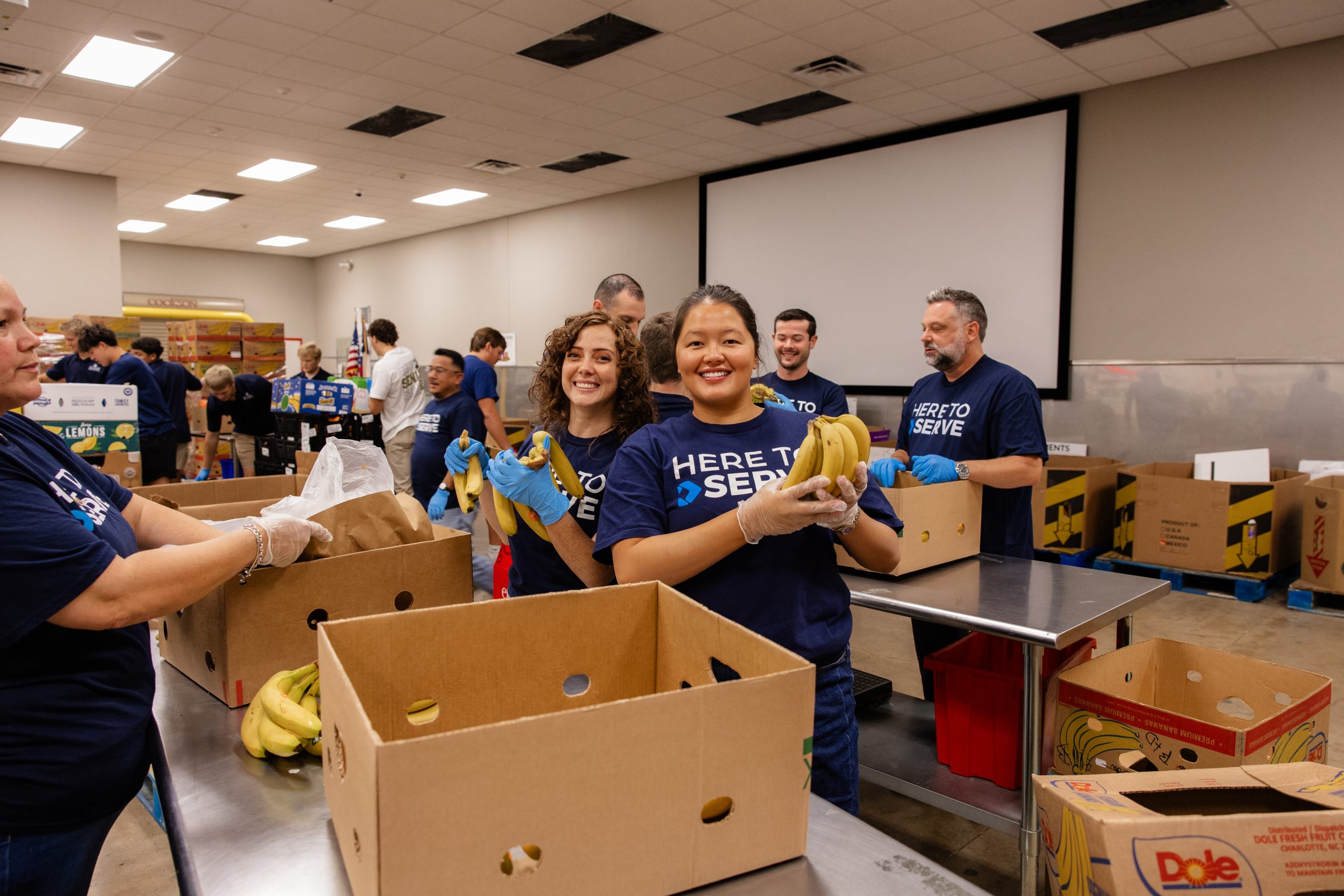 DOCUmation employees packing boxes during a community service event